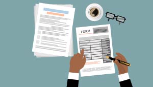 Person filling out a form.