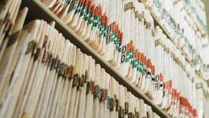 A picture of a bookshelf filled with labled manila folders