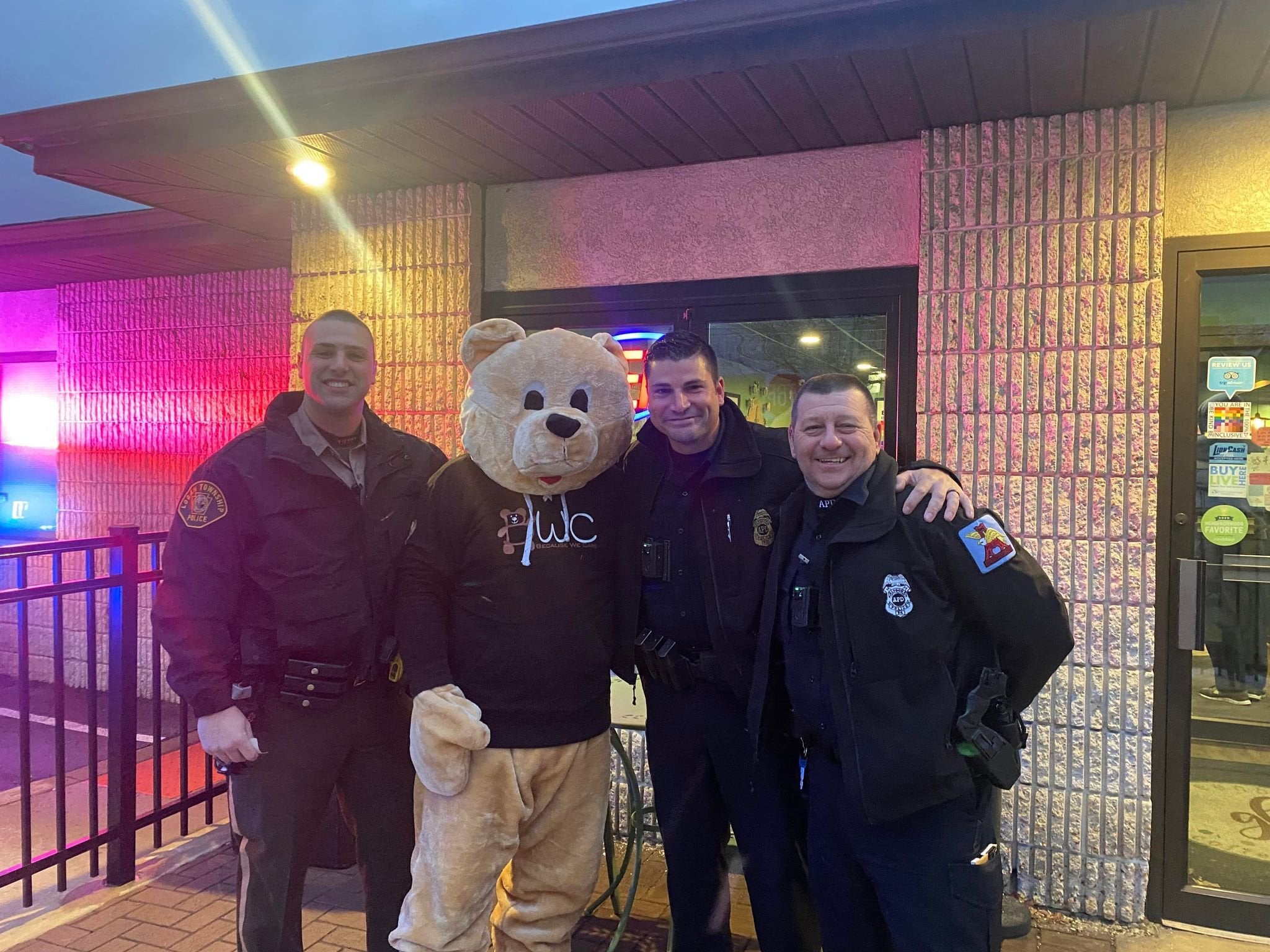BWC mascott and a group of officers getting their picture taken.